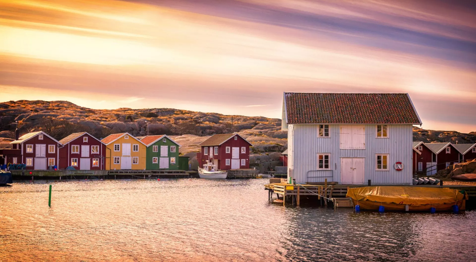 Beautiful landscape view of sunset and houses at Smogen
