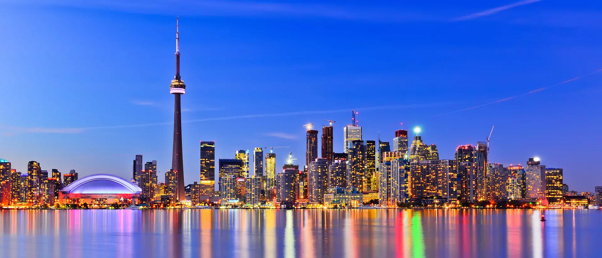 Toronto, Canada The city skyline at twilight reflecting in lake ontario