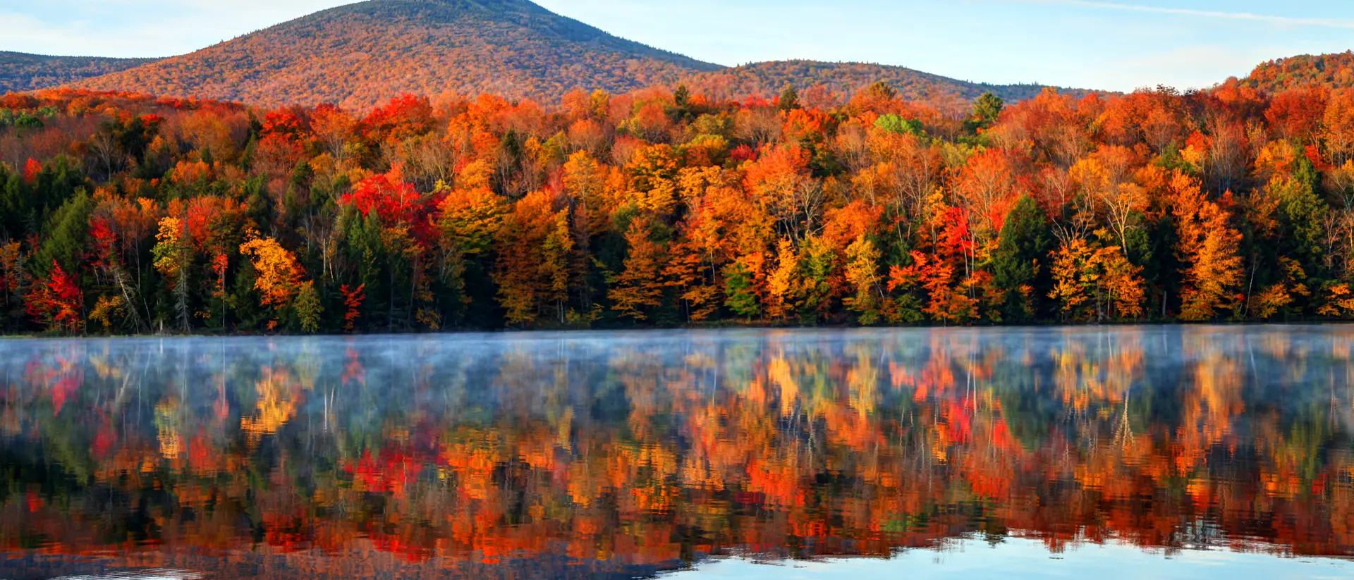 Lake Bomoseen, Vermont Calm tranquil colorful morning over the lake during the peak autumn foliage season