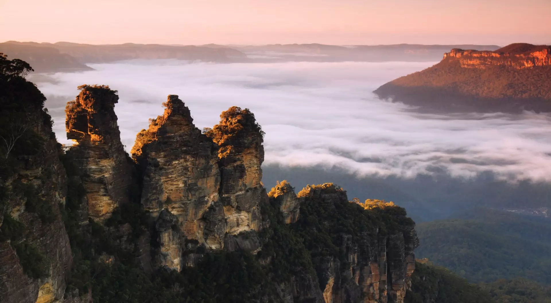 The Three Sisters, Katoomba, New South Wales Famous rock formations with some early morning fog around them