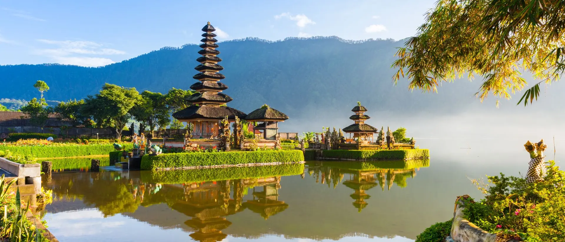 Famous temple with morning mists over the Danau Beratan lake