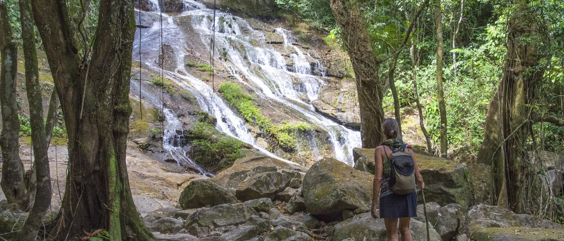 Bocawina Falls Woman approaching Bocawina Falls. Bocawina National Park, Belize.