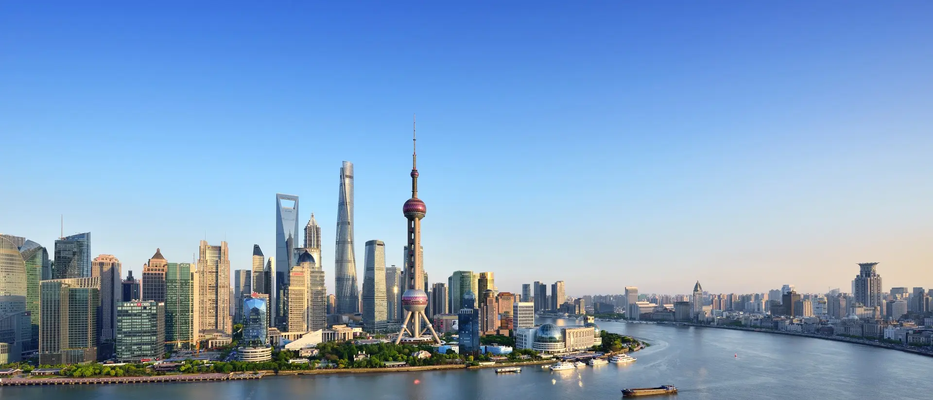 Shanghai skyline in blue sky at sunset