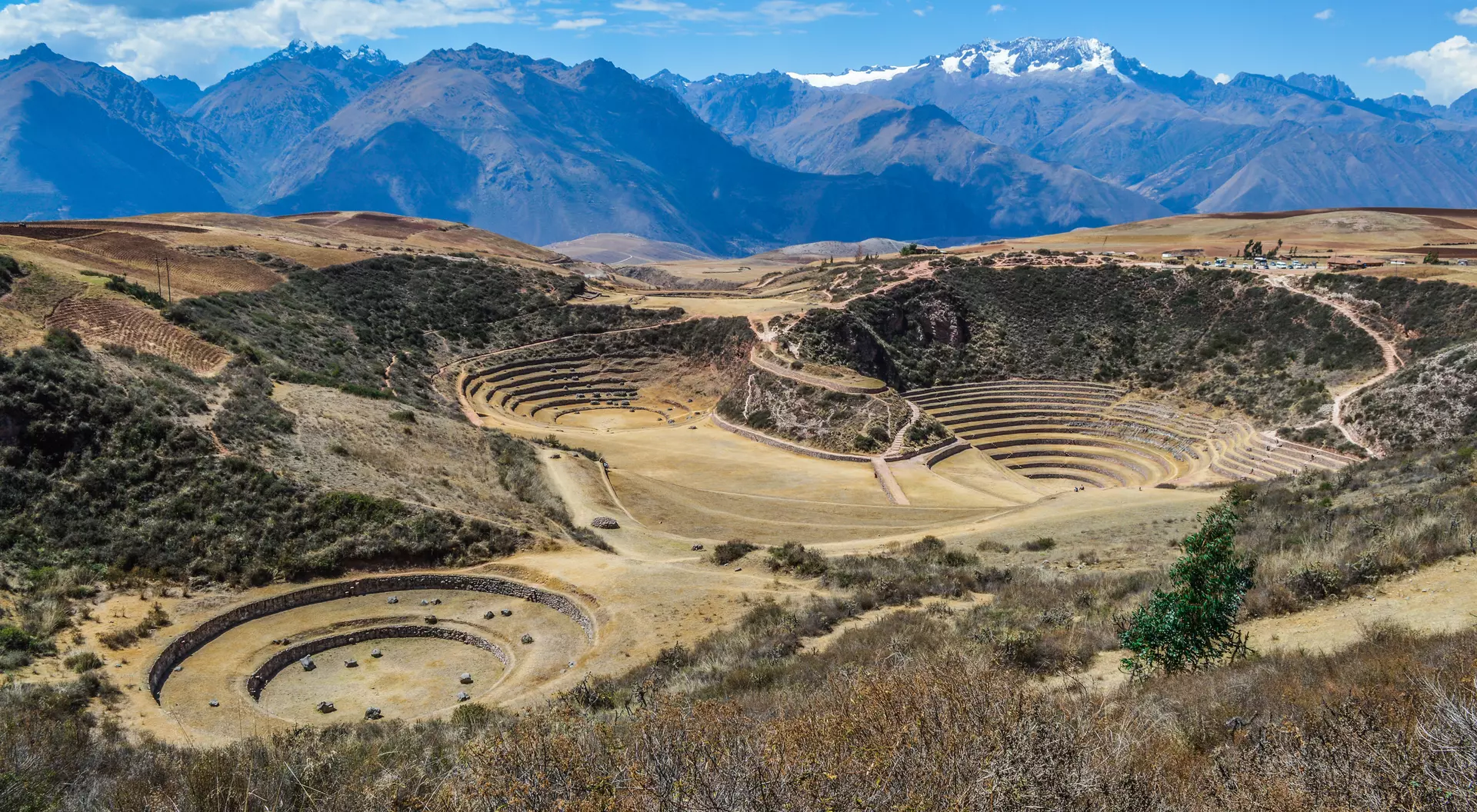 Moray Ancient Inca circular terraces with Andes mountains in the background