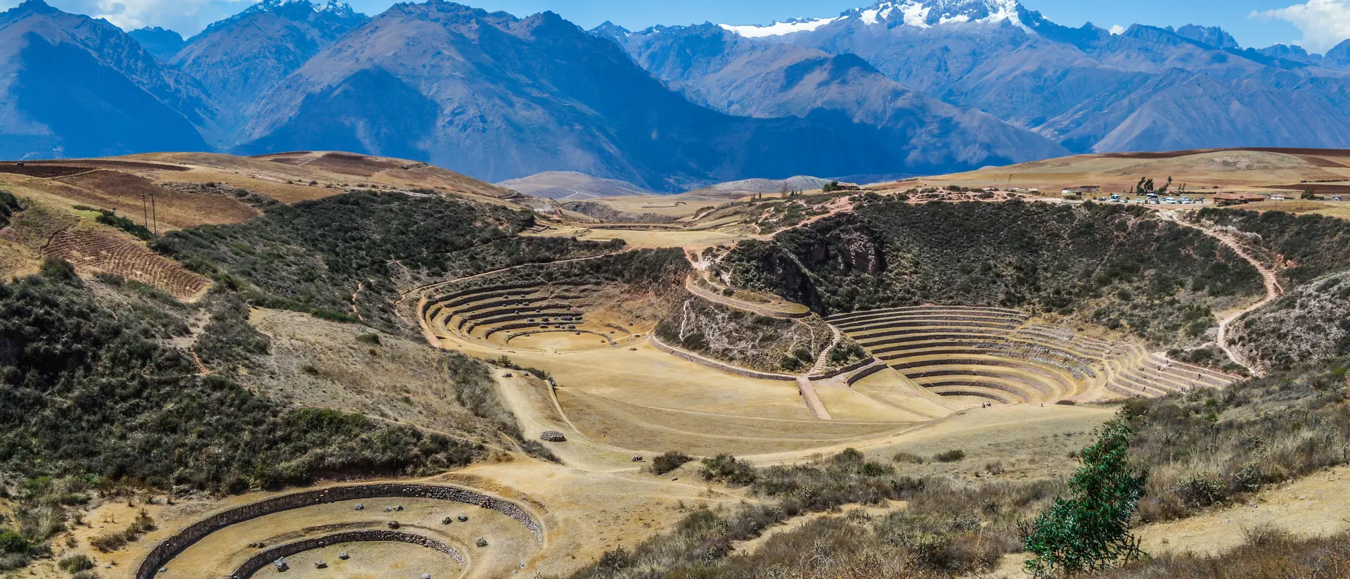 Moray Ancient Inca circular terraces with Andes mountains in the background