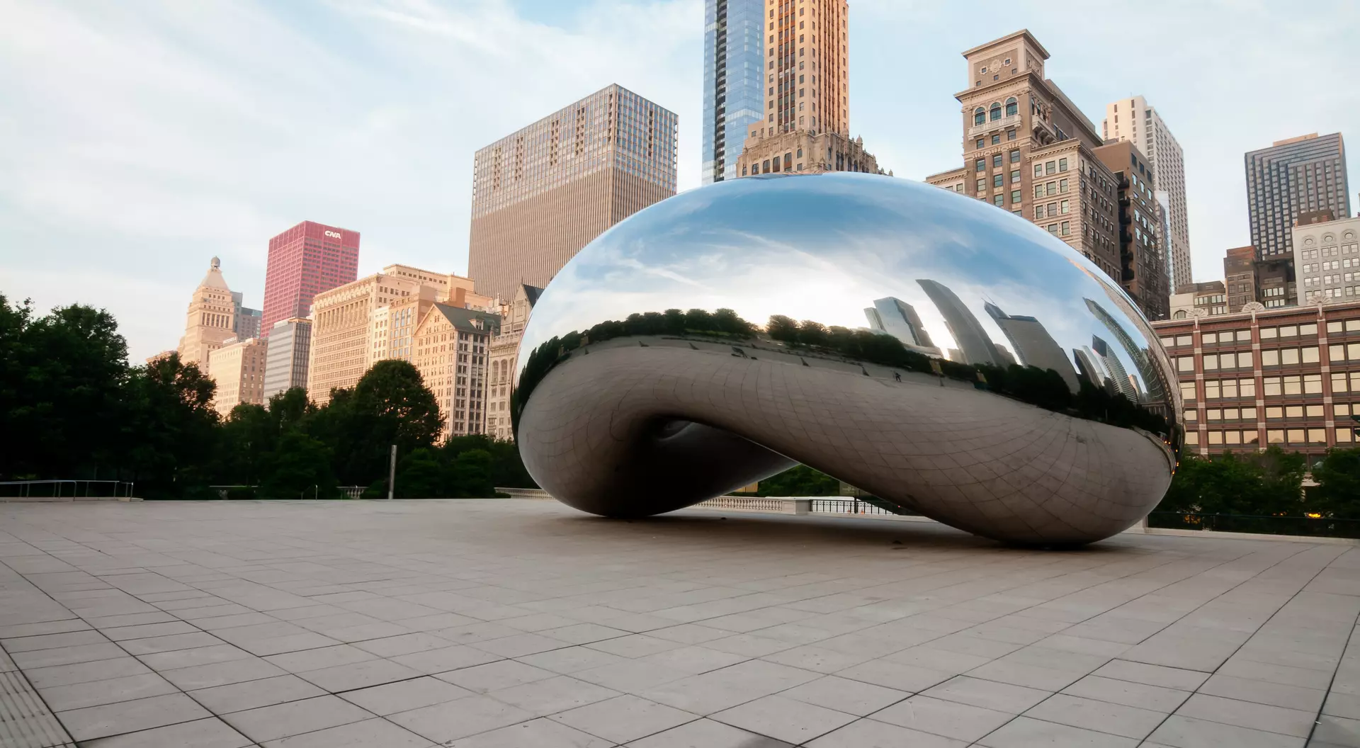 Illinois The Bean and Chicago skyline early in the day in Millennium Park just after sunrise
