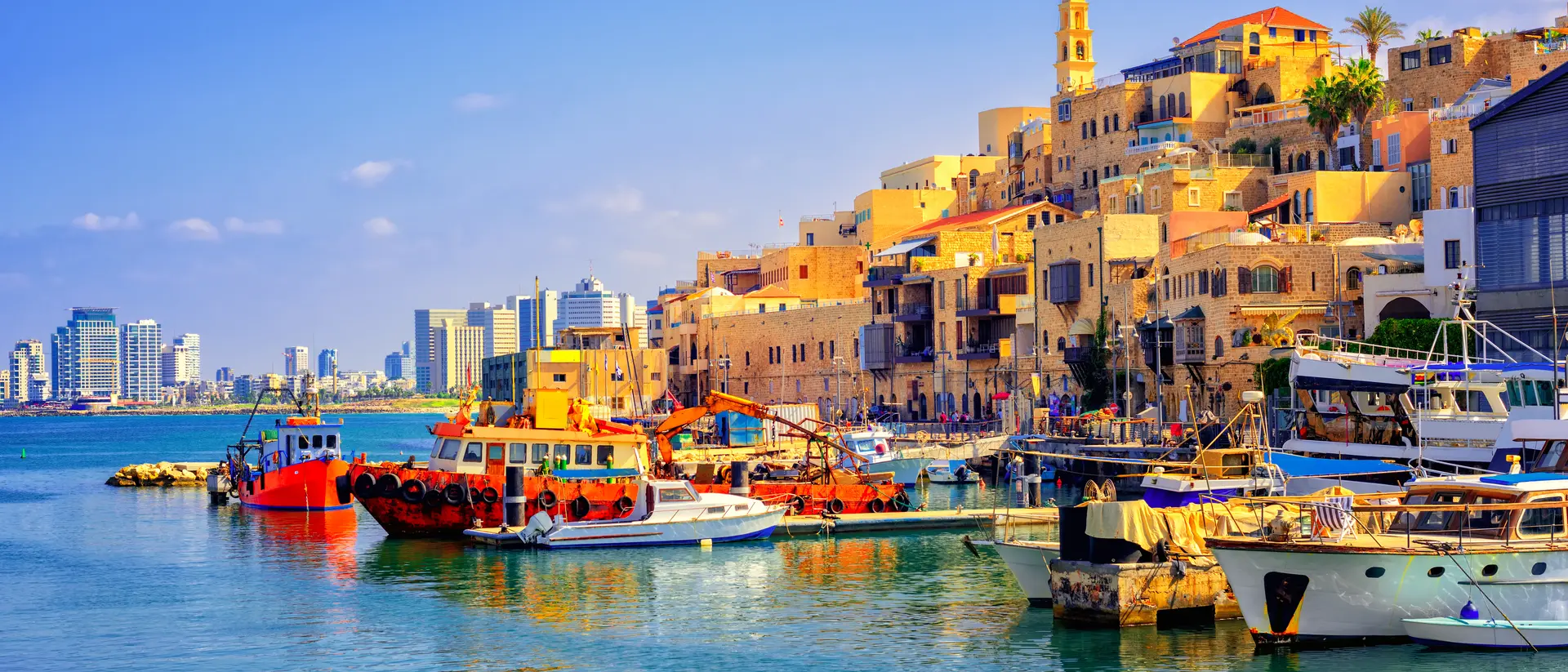 Old town and port of Jaffa and modern skyline of Tel Aviv city