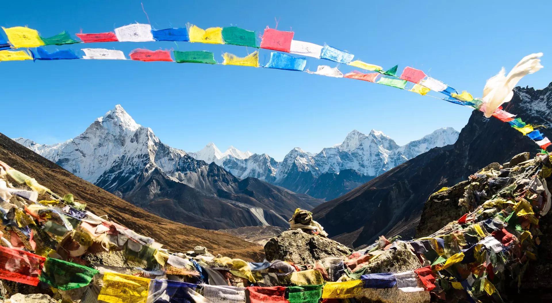 Ama Dablam mountain, framed with praying flags in Himalaya, Nepal.