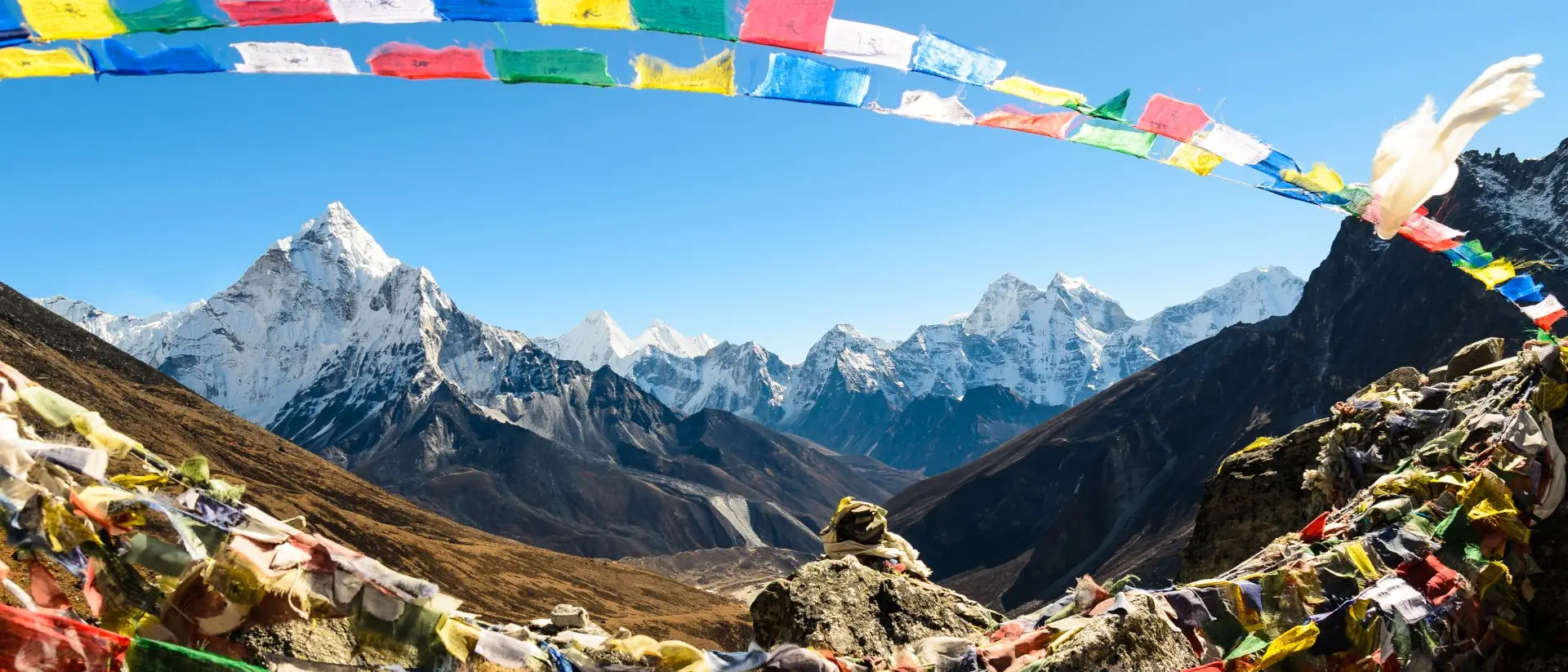 Ama Dablam mountain, framed with praying flags in Himalaya, Nepal.