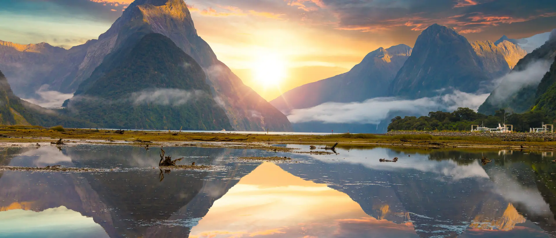 Famous Mitre Peak rising from the Milford Sound fiord. Fiordland national park, New Zealand