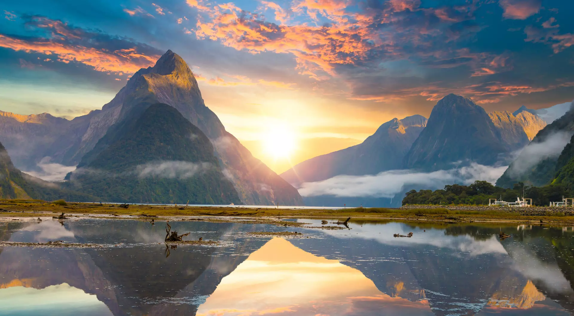 Famous Mitre Peak rising from the Milford Sound fiord. Fiordland national park, New Zealand