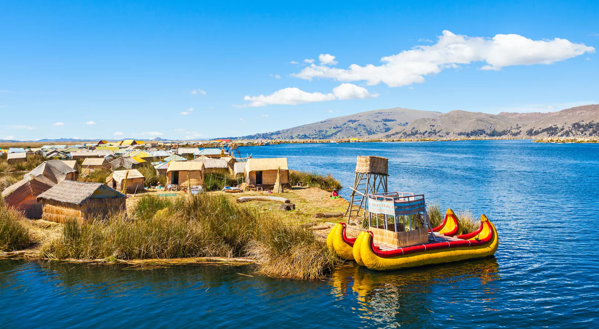 Uros fishing boat floating on Titicaca Lake near Puno, Peru