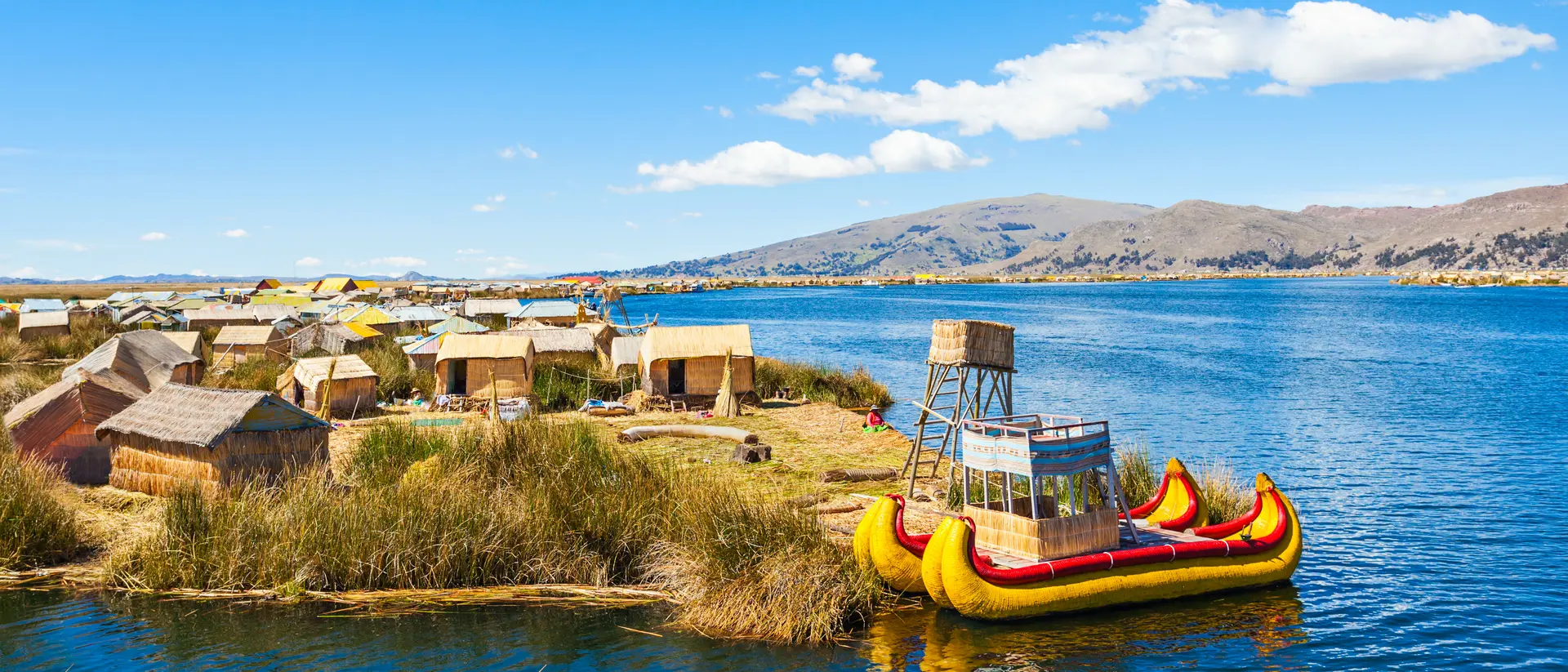 Uros fishing boat floating on Titicaca Lake near Puno, Peru