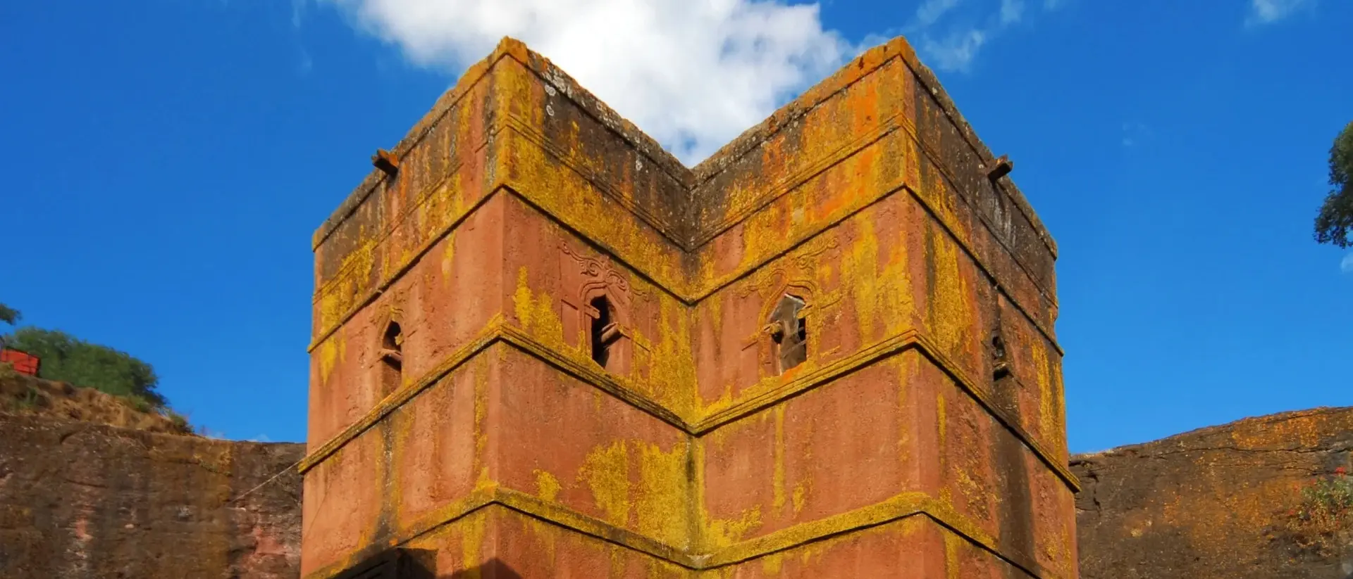 Rock-hewn Church of Saint George / Biete Giyorgis - carved from red volcanic rock in the shape of a cross - 12th century