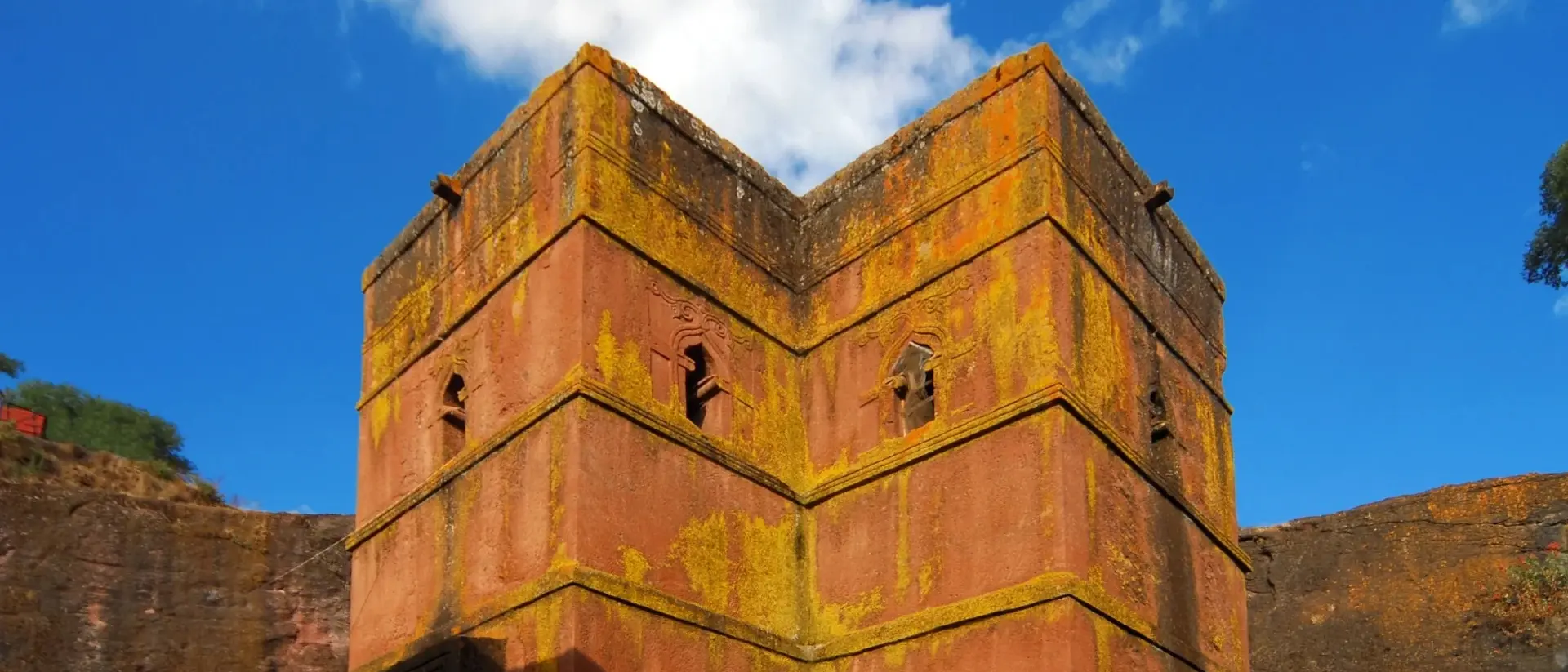 Rock-hewn Church of Saint George / Biete Giyorgis - carved from red volcanic rock in the shape of a cross - 12th century
