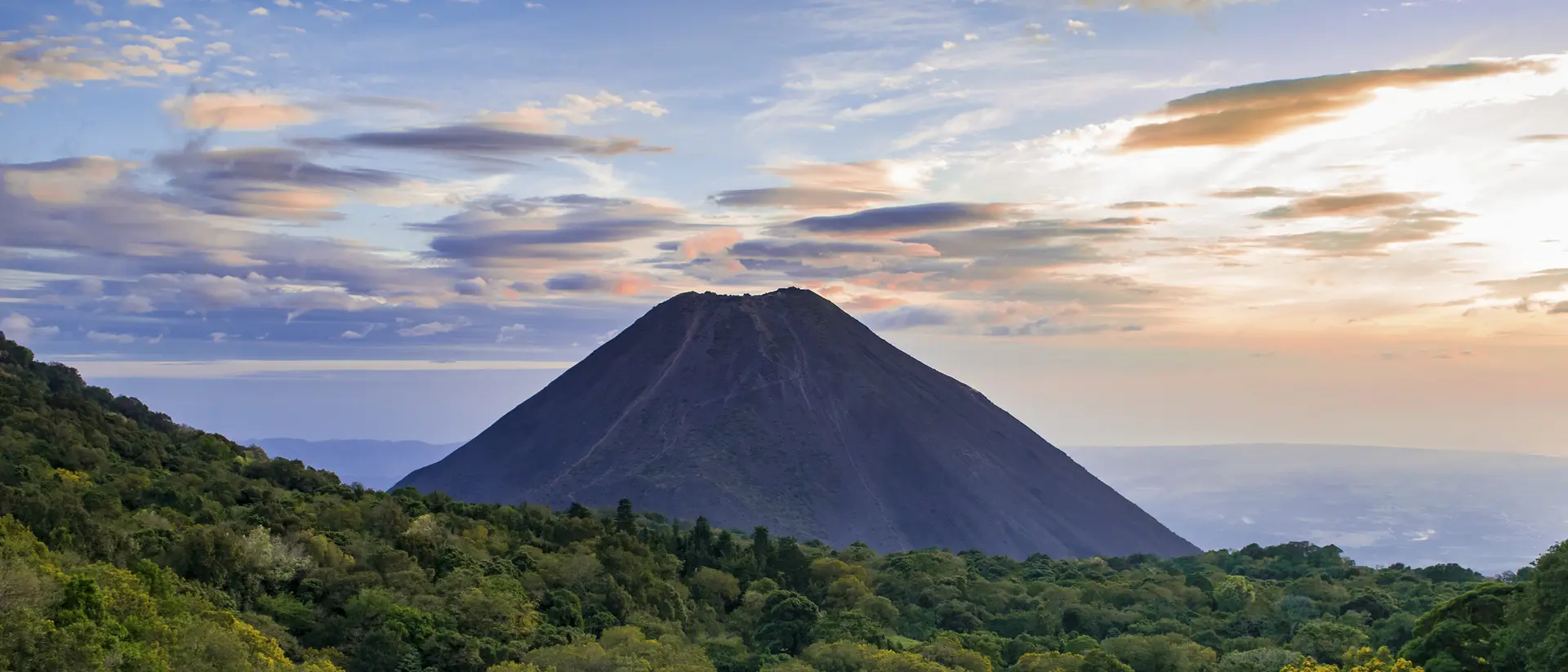 Volcanoes National Park View of Izalco volcano with beautiful clouds around it in El Salvador