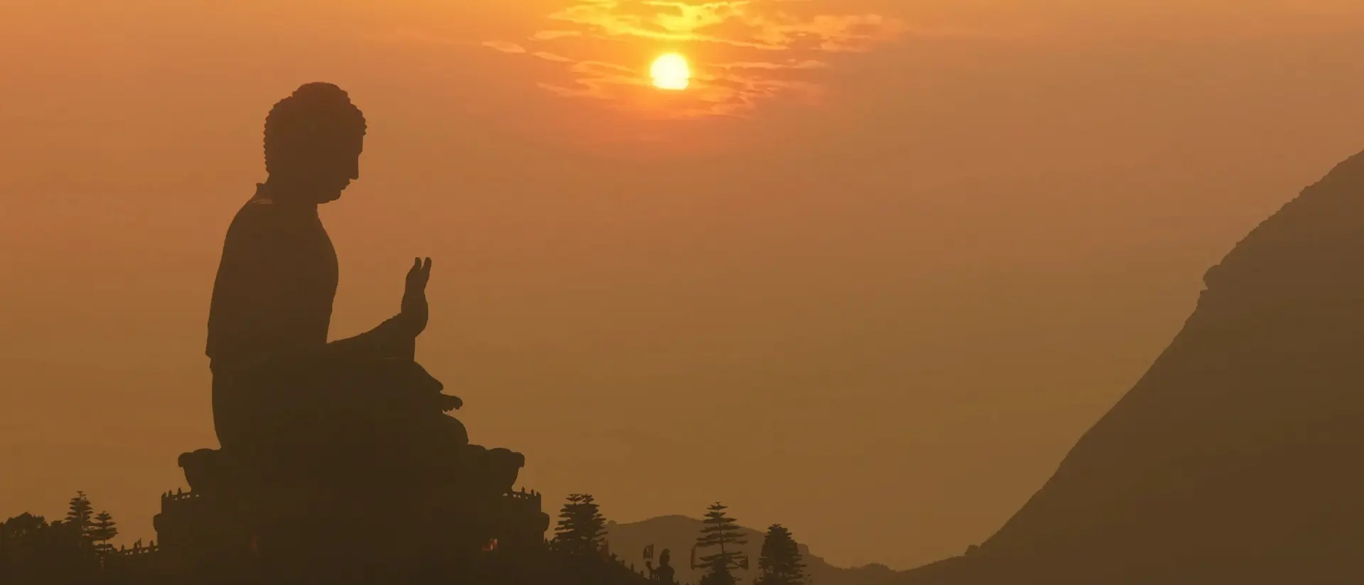 Hong Kong Big Buddha silhouette at sunset