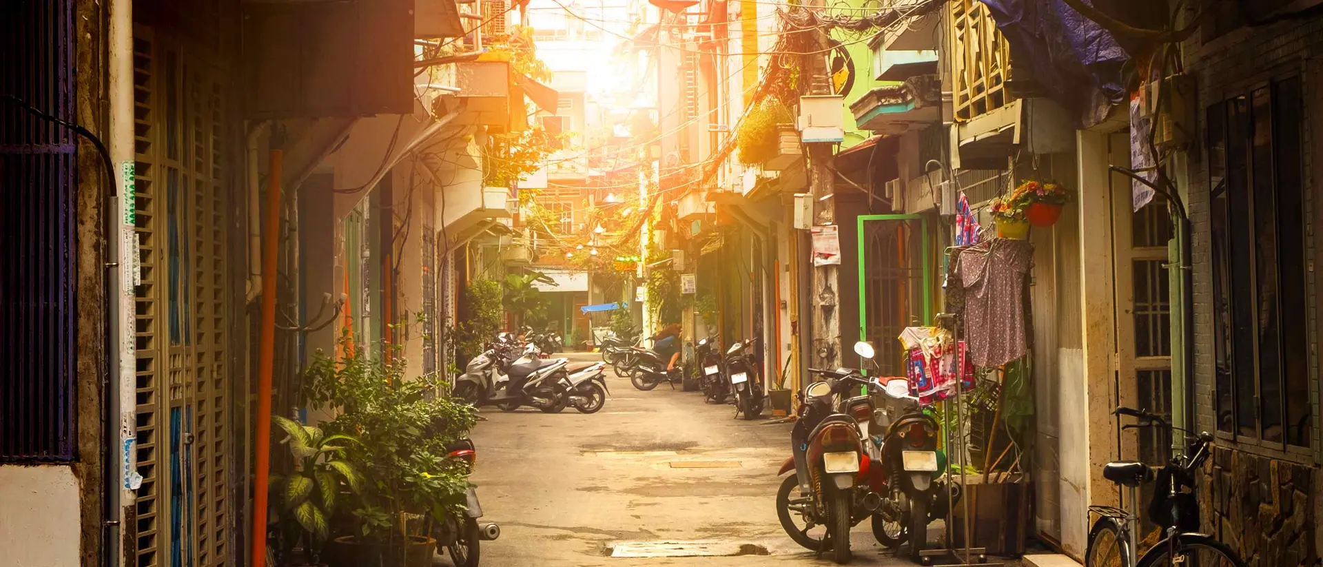 Ho Chi Minh City Motor bikes lined down narrow street of Ho Chi Minh city, Vietnam