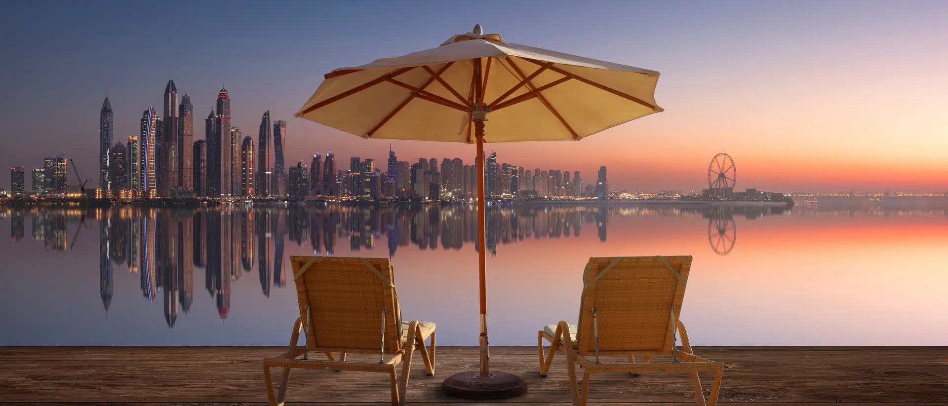Beautiful beach in Dubai with the skyline of Dubai Marina on the horizon