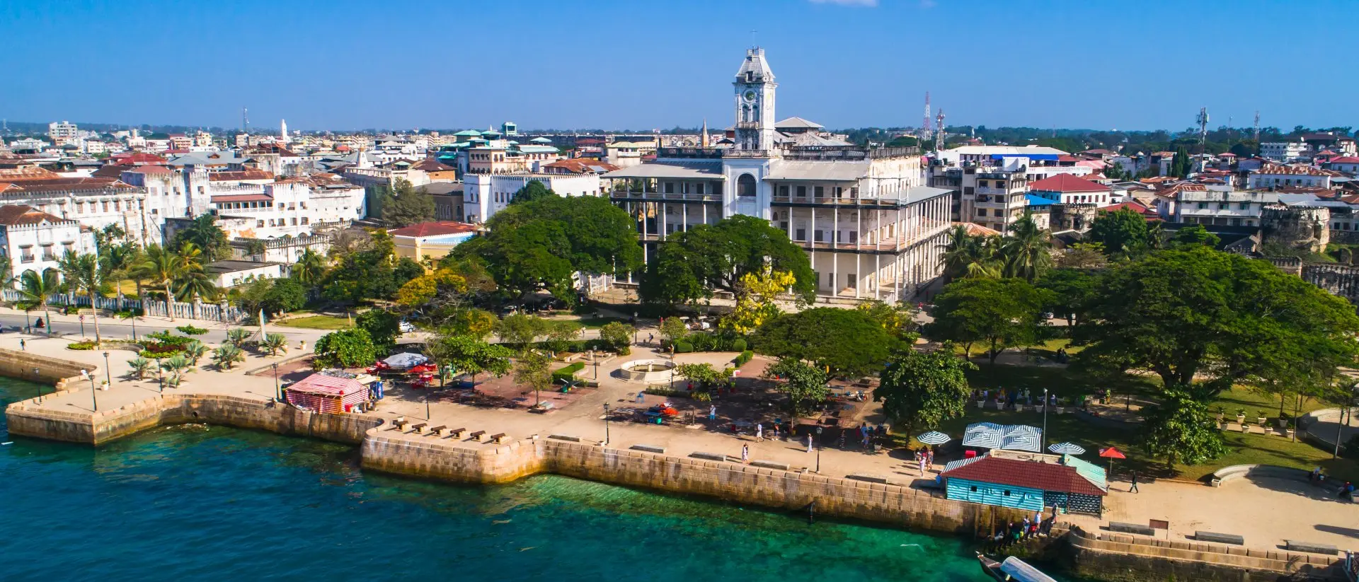 Stone Town, Zanzibar A bird's-eye view of Stone Town, captures the essence of this historic coastal city, its vibrant streets and ancient landmarks intertwined with the azure embrace of the Indian Ocean.