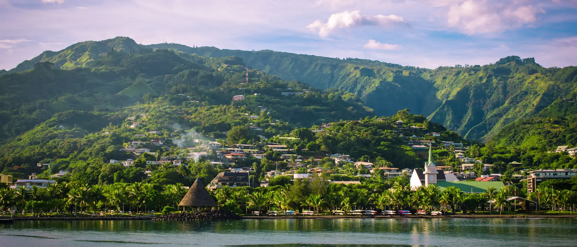 Tahiti Island Landscape of Tahiti with mountains and village close to the port of Papeete, French Polynesia