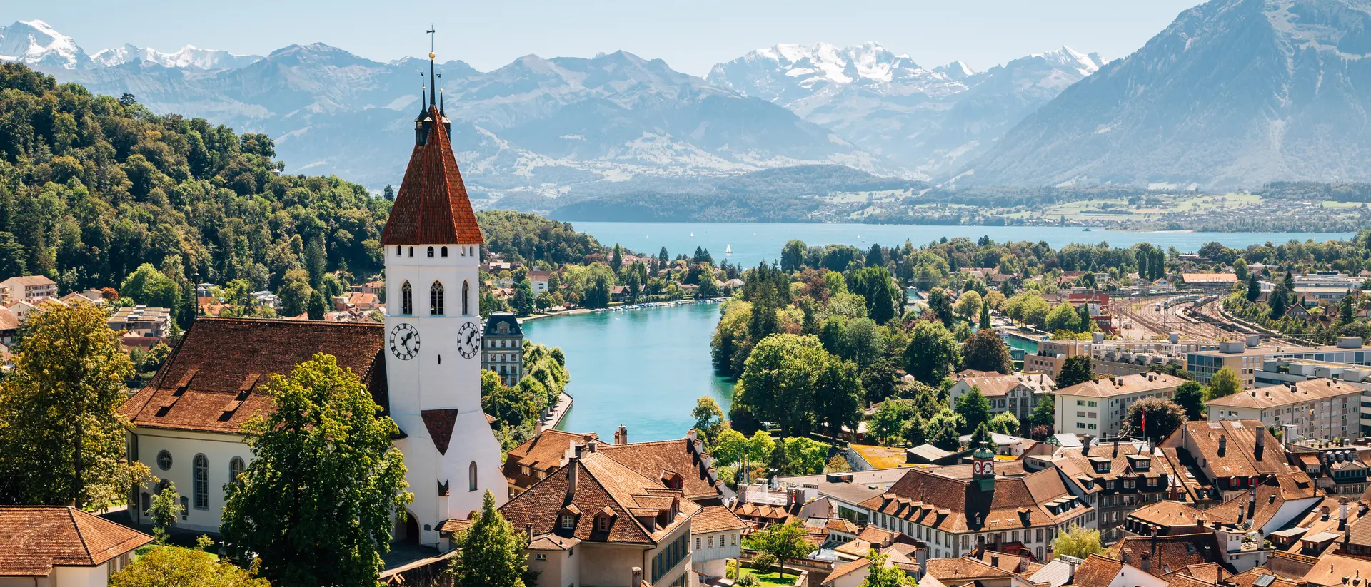 Interlaken, Switzerland Aerial view of Interlaken with the Swiss Alps and lake Thun in the background.