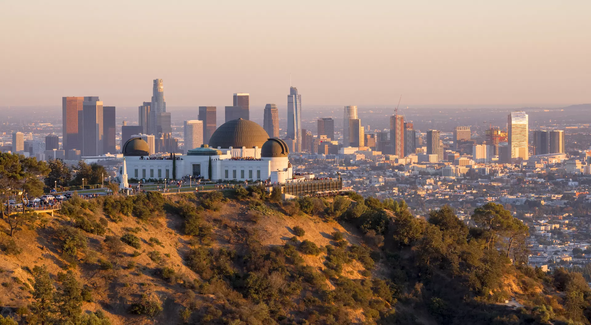 Downtown skyline behind Griffith Observatory at sunset