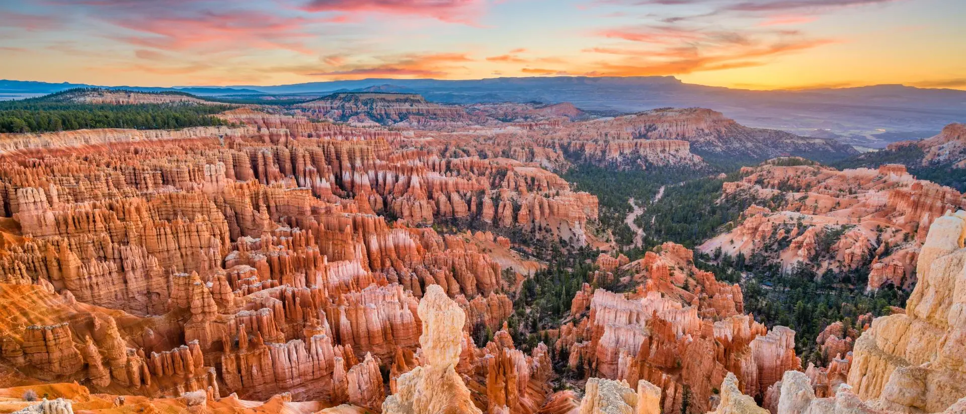 Stone and geographic formations of canyon at sunrise