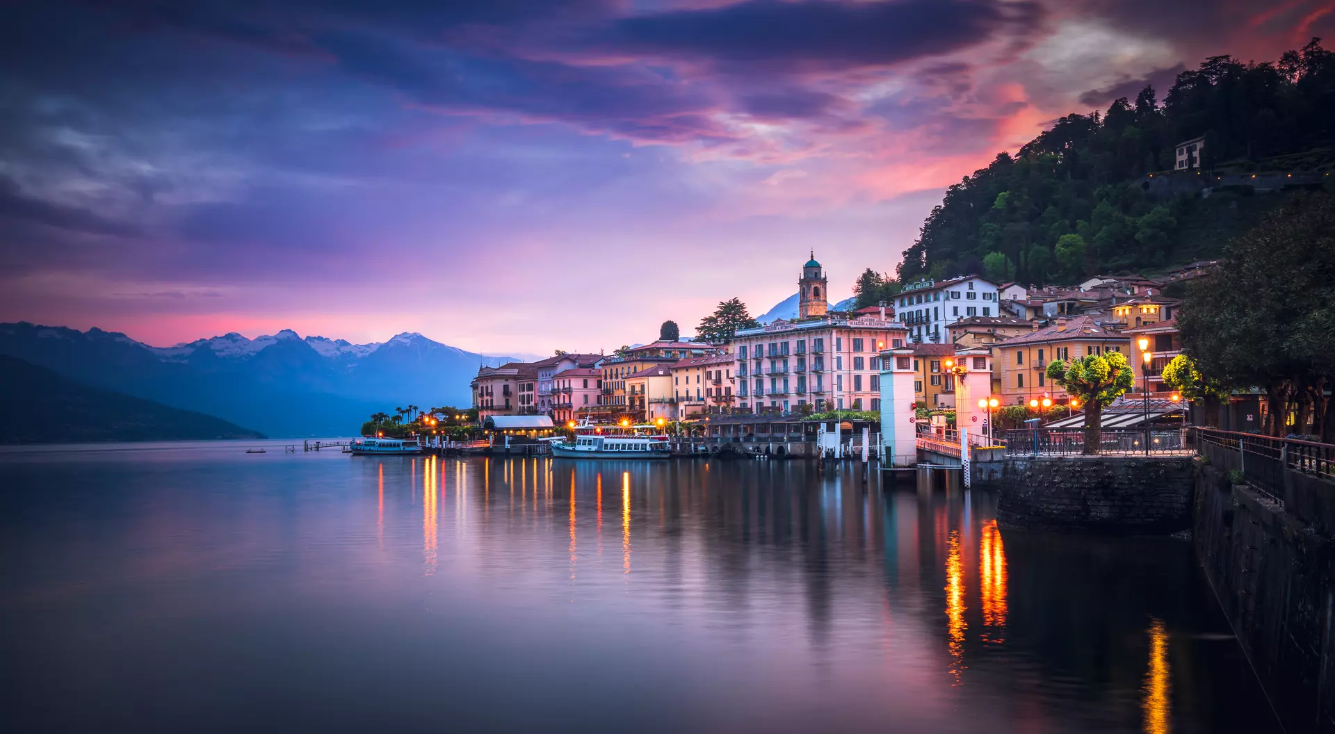 Bellagio, Como, Lombardy Sunrise over lake town with brilliant purple hues and waters