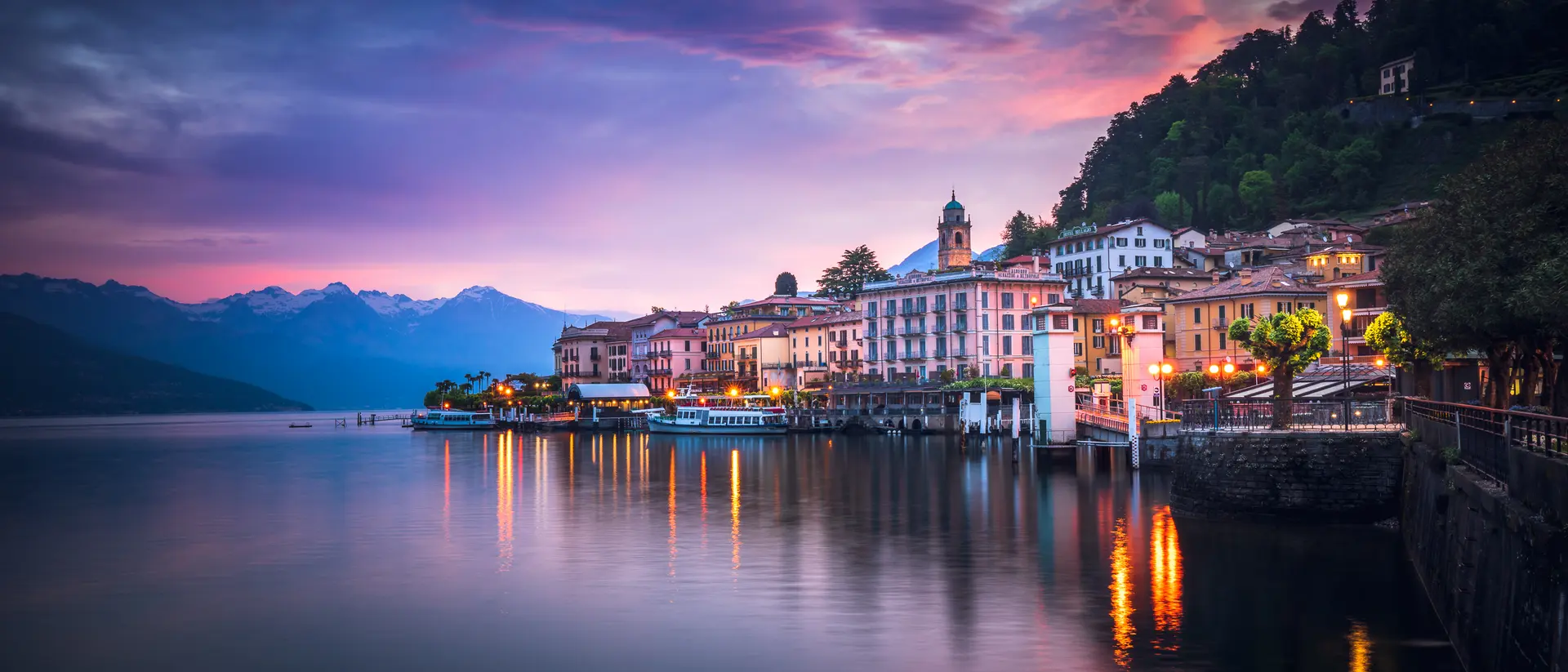 Bellagio, Como, Lombardy Sunrise over lake town with brilliant purple hues and waters