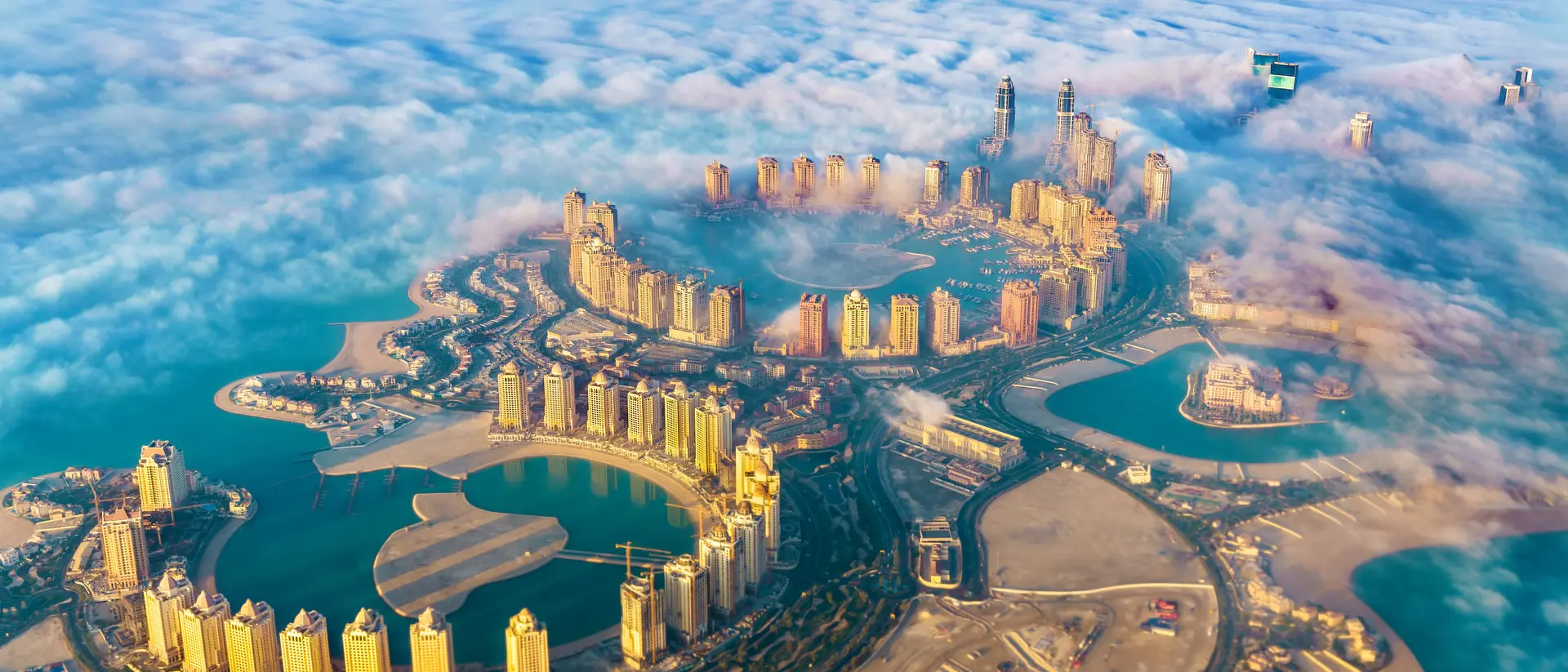 Pearl Island is a feat of modern engineering in Doha Aerial view of the Pearl. Qatar island in Doha through the morning fog