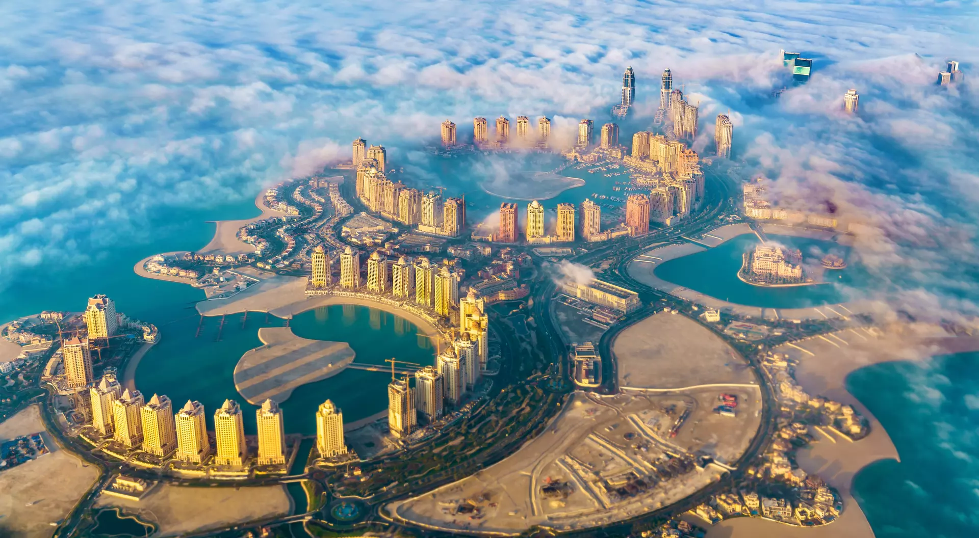 Aerial view of the Pearl. Qatar island in Doha through the morning fog