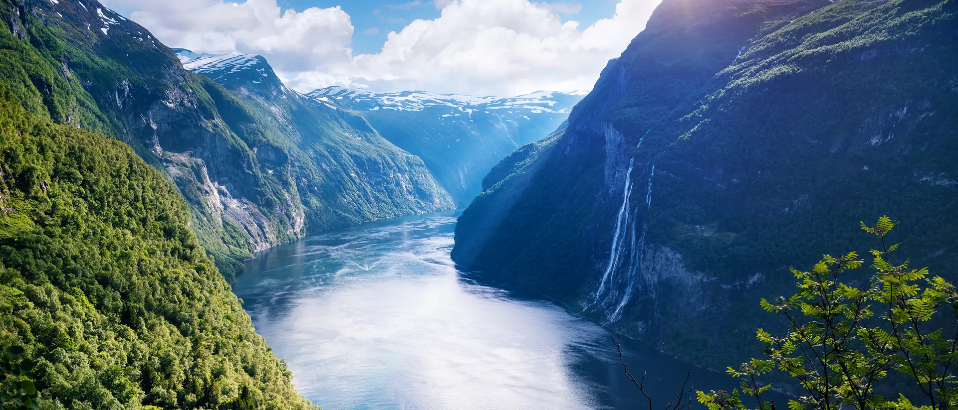 Seven Sisters waterfall, Geirangerfjorden, Sunnmøre, Møre og Romsdal View of the old mountain farm and the famous waterfall overlooking the stunning fjord