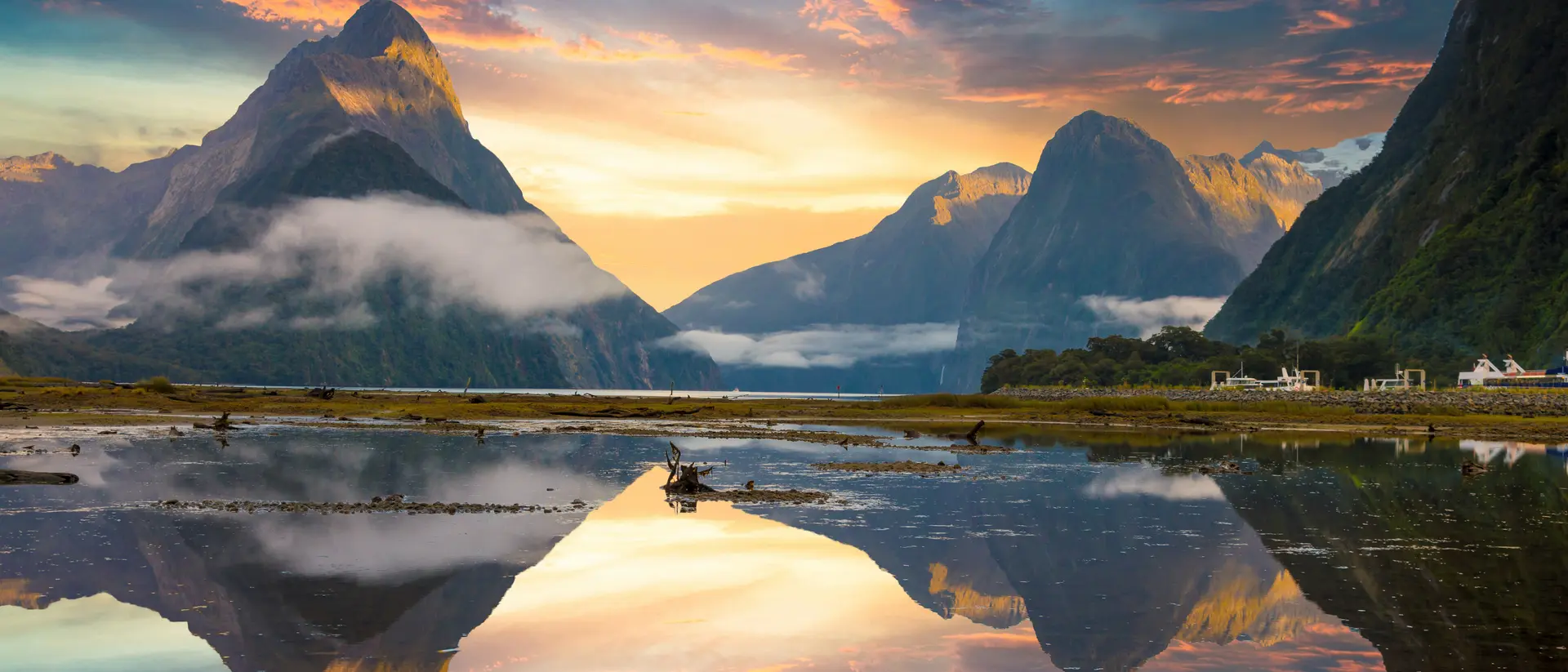 Famous Mitre Peak rising from the Milford Sound fiord. Fiordland national park,