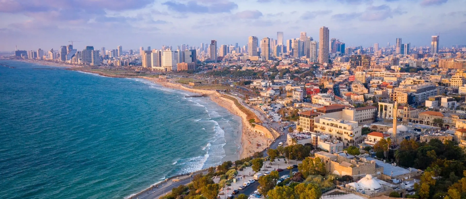 High Angle View Of Buildings By Sea Against Sky
