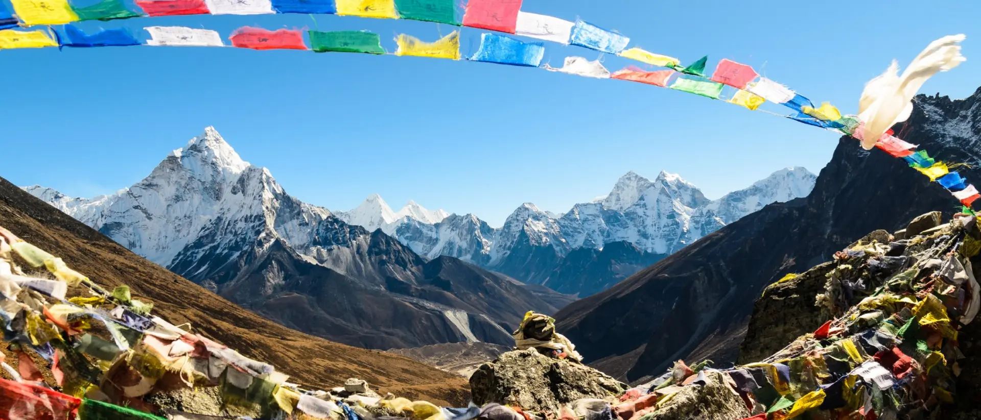 Ama Dablam framed with praying flags in Himalaya