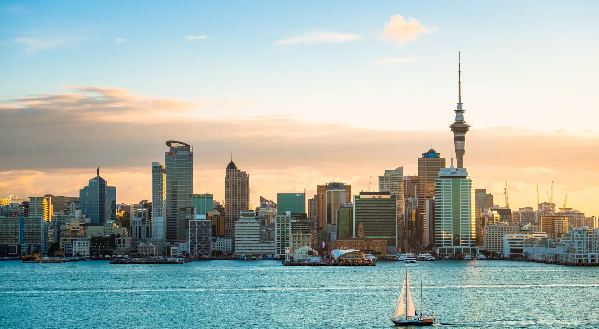 A view of Auckland Harbour in the morning with a sailboat in New Zealand.