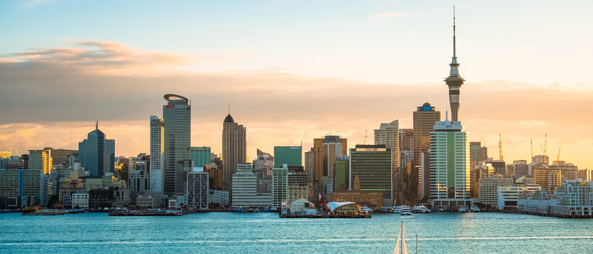 A view of Auckland Harbour in the morning with a sailboat in New Zealand.