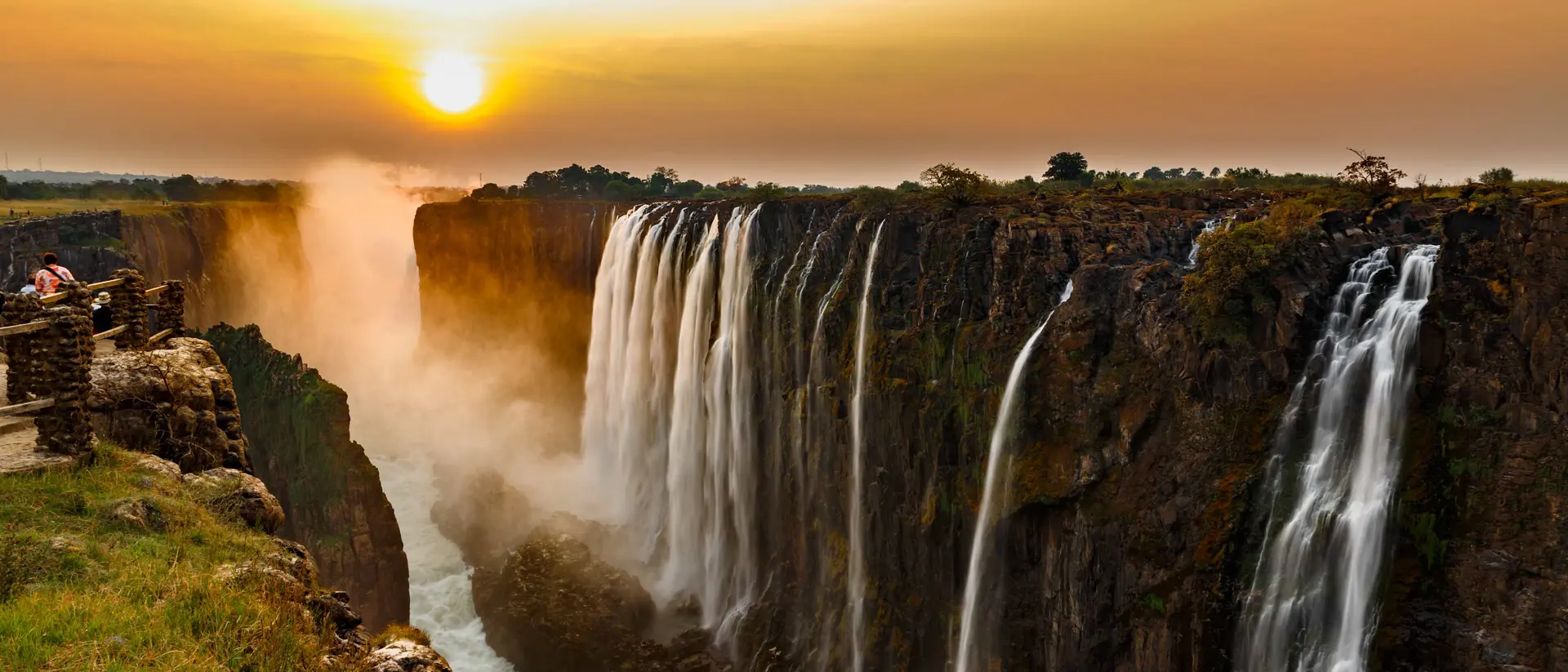 Victoria Falls Panorama of Victoria Falls at sunset.