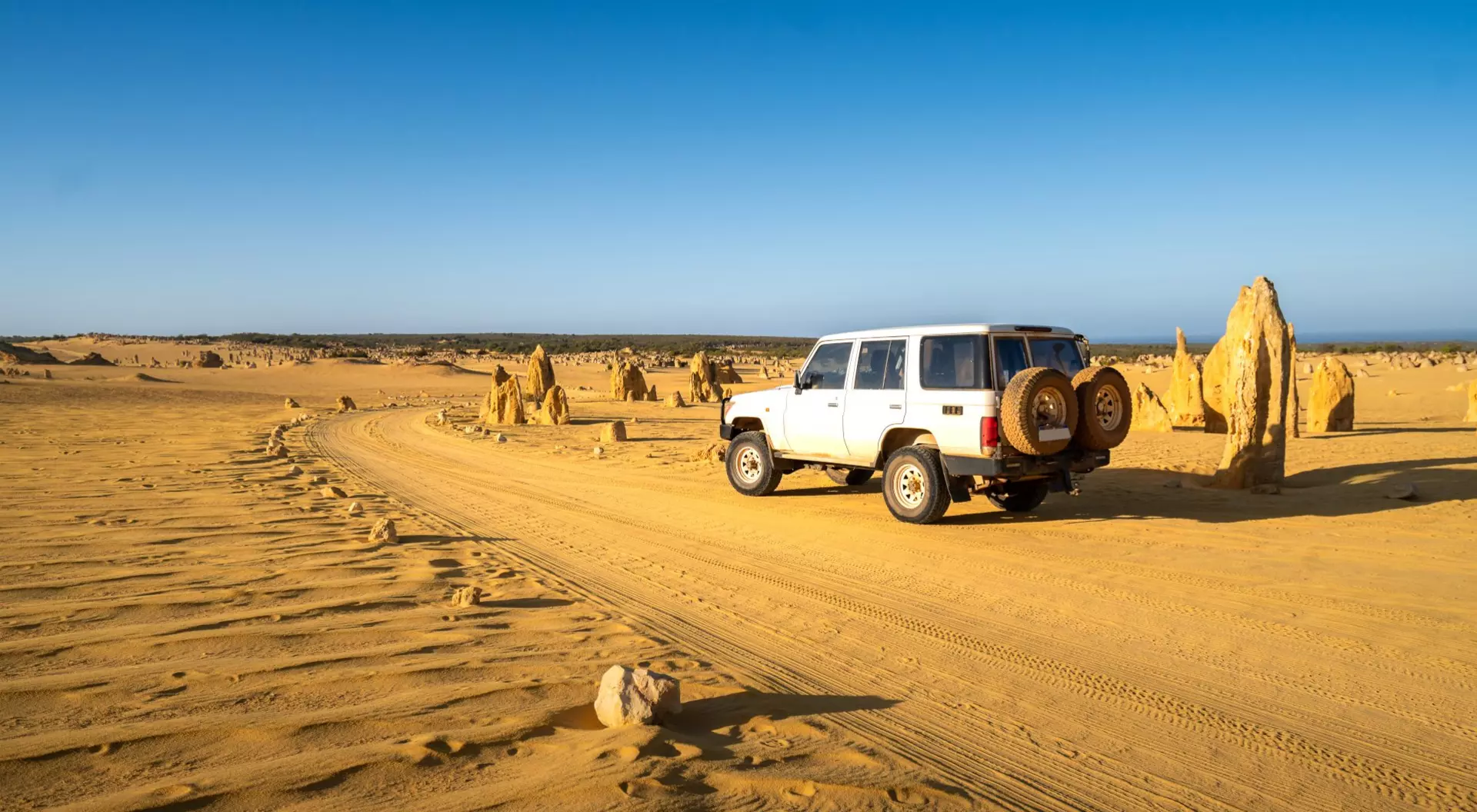 Western Australia Four-wheel-drive car in the Pinnacles Desert, Nambung National Park, Western Australia.