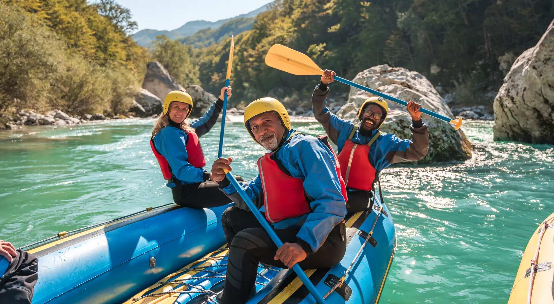 Slovenia A group of people kayaking on a river in Slovenia