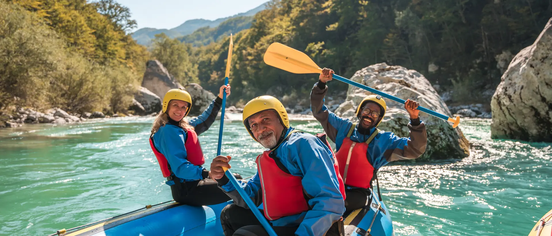 Slovenia A group of people kayaking on a river in Slovenia