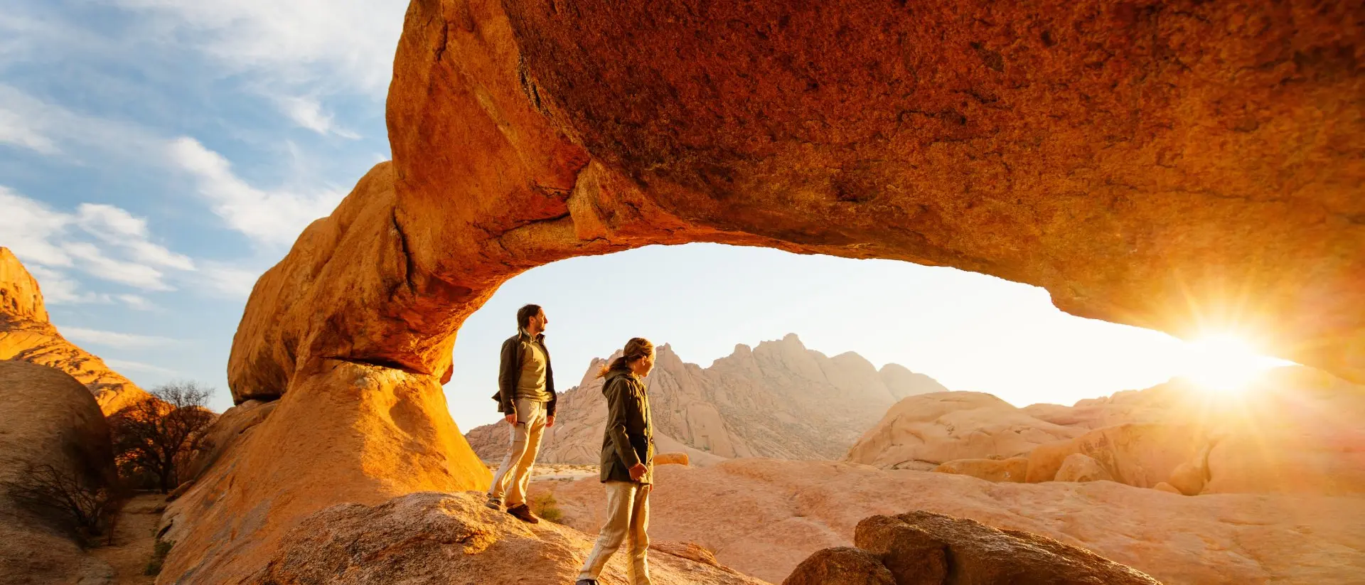 Spitzkoppe, Namibia sunrise red rock people hiking