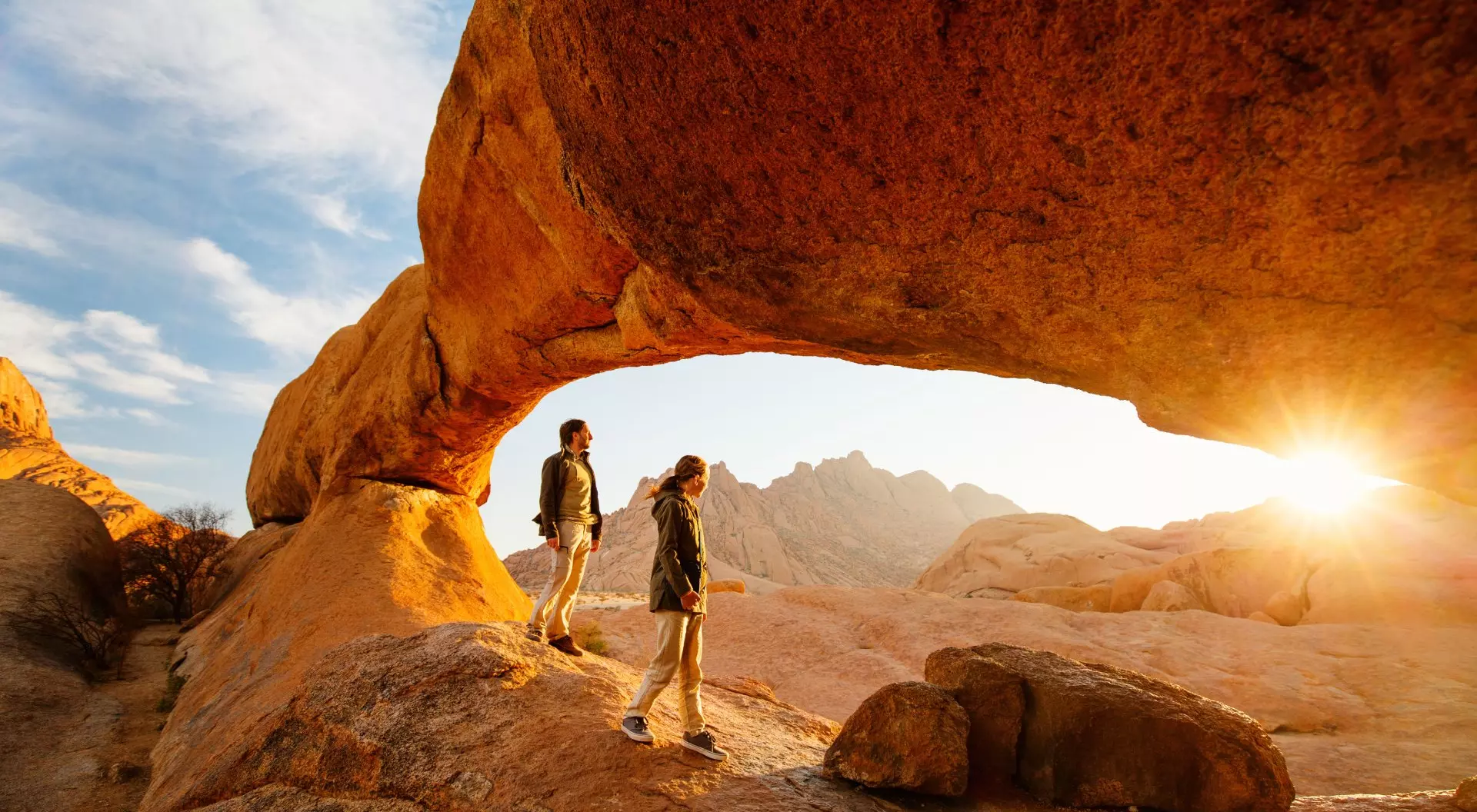 sunrise red rock people hiking