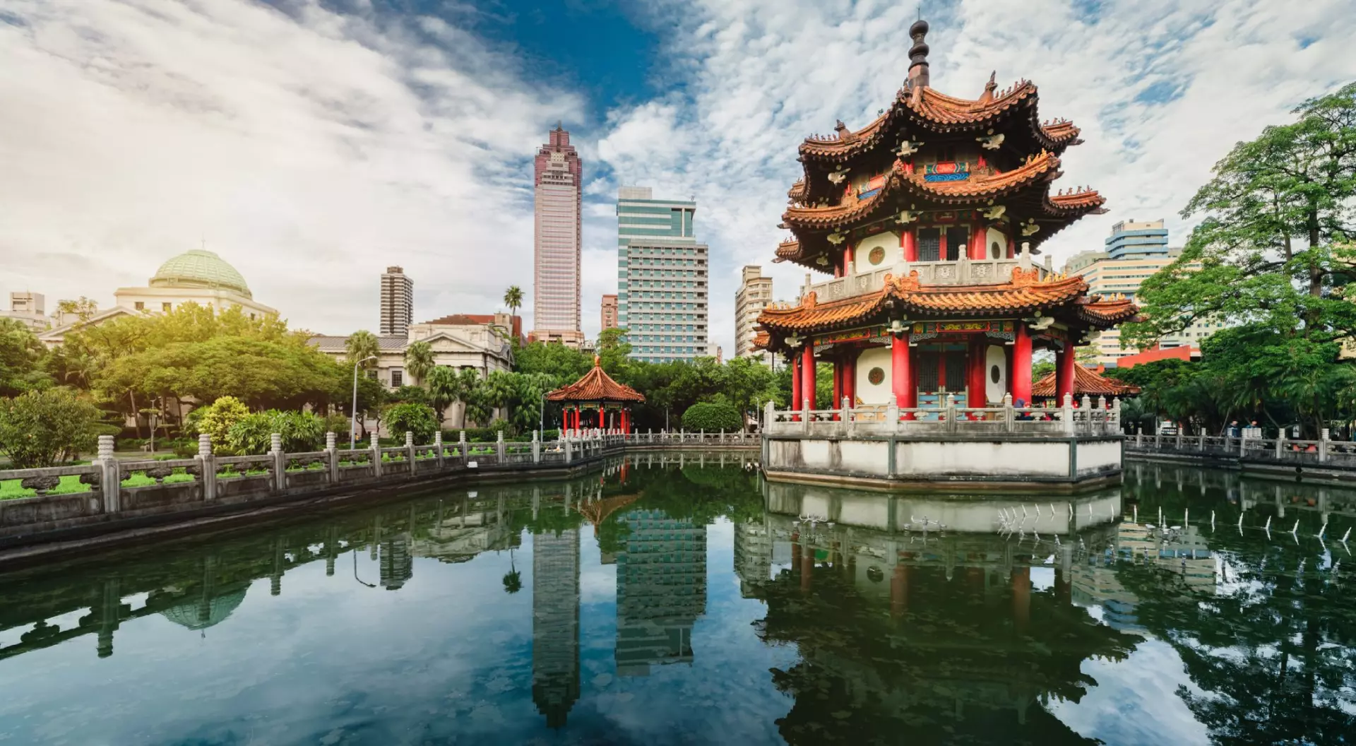 Sunset of 228 national park with modern building and pond reflection