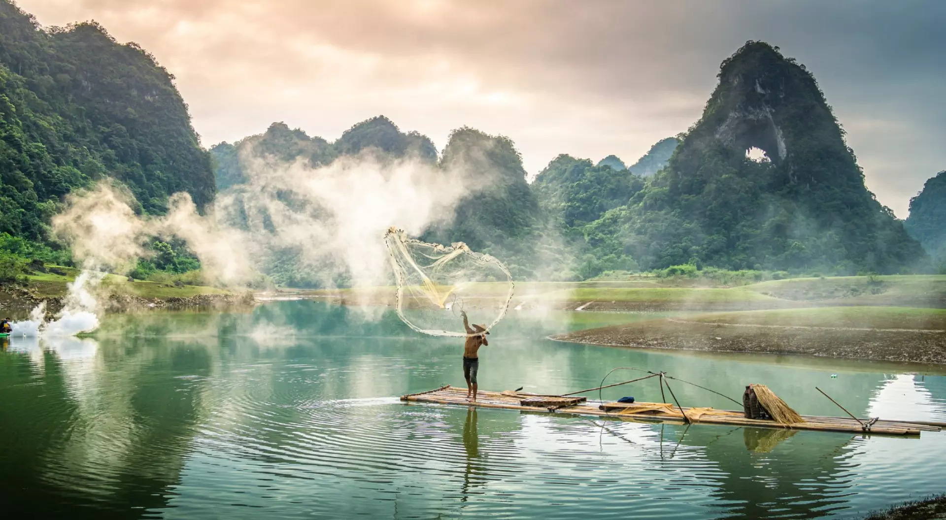 View of fishermen fishing on river in Thung mountain in Tra Linh