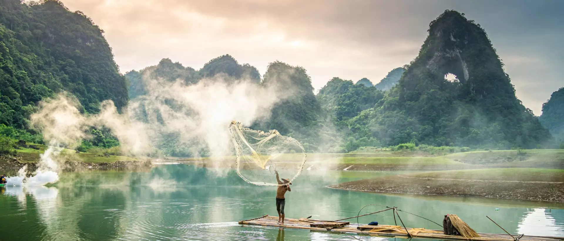 View of fishermen fishing on river in Thung mountain in Tra Linh