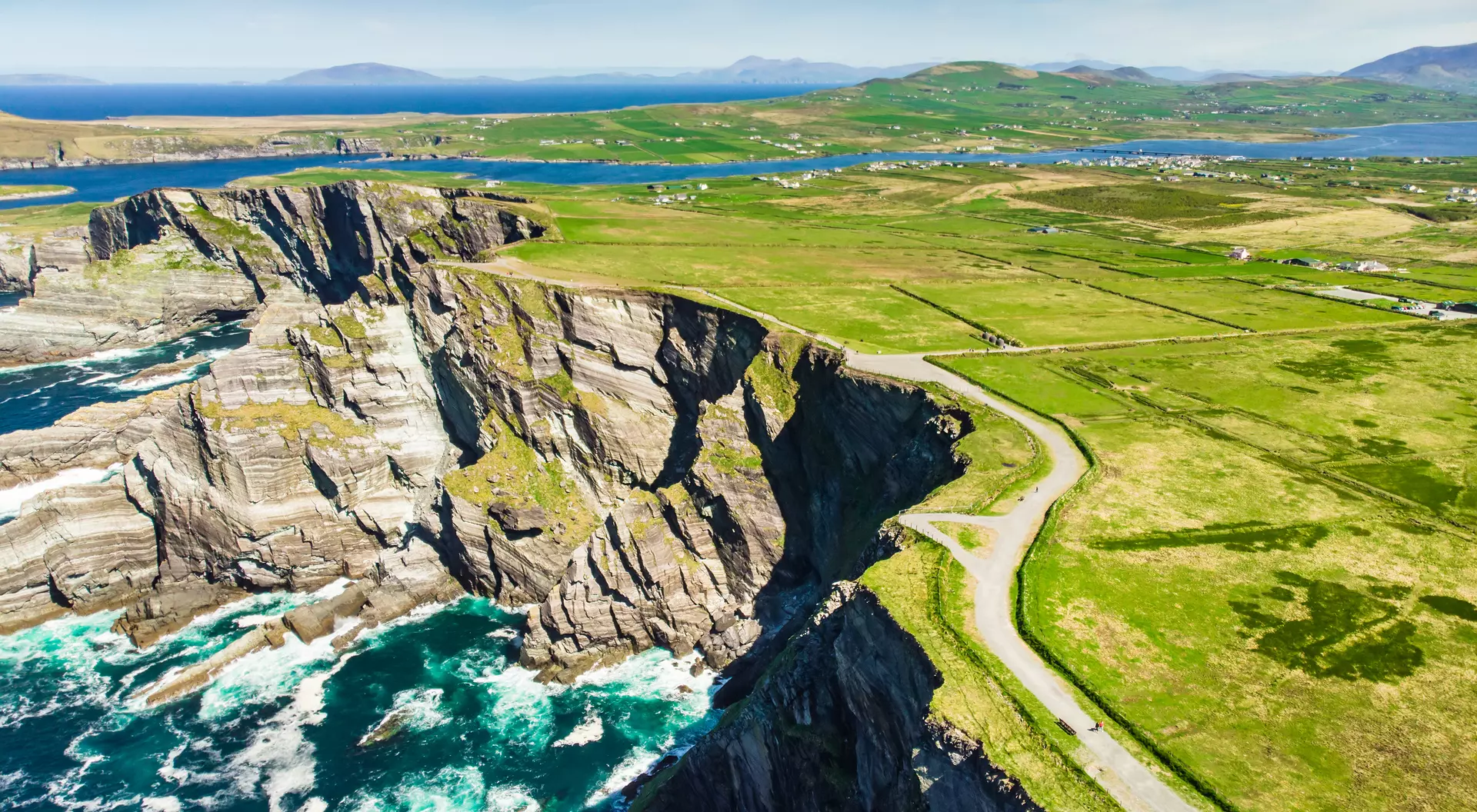 Amazing wave lashed Kerry Cliffs, the most spectacular cliffs in County Kerry, Ireland. Tourist attractions on famous Ring of Kerry route.