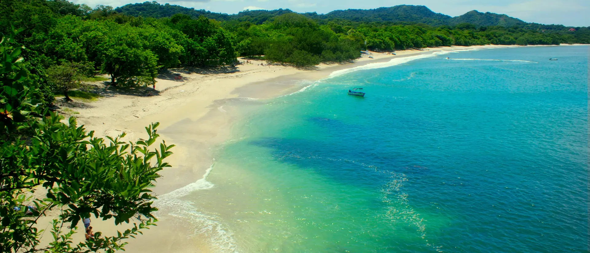 A view of Conchal Beach, it is known for its white sand and clear blue water.