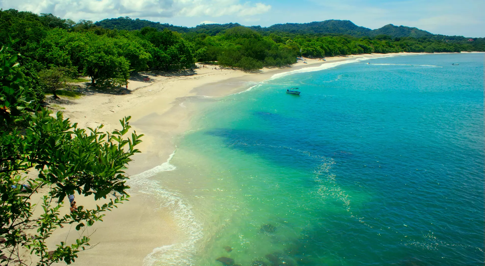 A view of Conchal Beach, it is known for its white sand and clear blue water.
